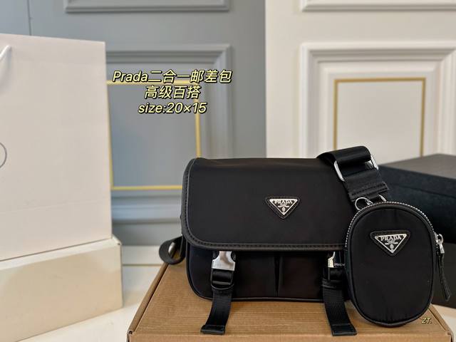 p130（配盒） size：20×15 prada 普拉达二合一邮差斜挎包 尼龙材质，轻便防水！ 黑银配色，高级感十足！ 内里容量大，时尚不失轻便～ 男女通用，