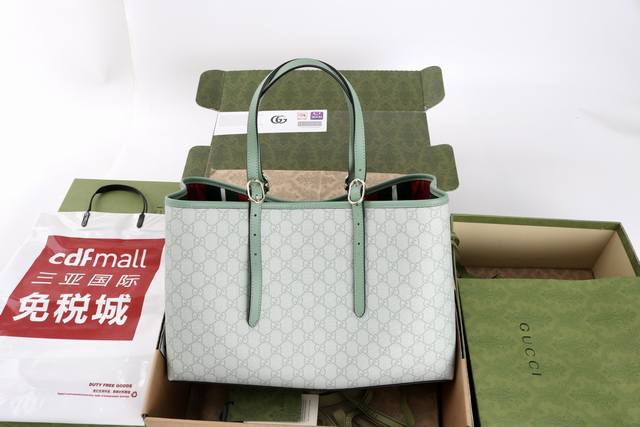 价 。 最高版本原厂皮顶级原单配专柜全套包装 简介：这款购物袋Gg图案和条纹织带这两种品牌颇有辨识性的元素融合成经典搭配，Ophidia世界的演化之路从未止息，