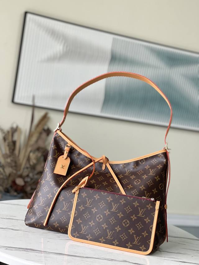 顶级原厂 M46197 推出崭新 Carryall 中号手袋，以 Monogram 帆布和皮革饰边塑造贴合身形的设计。充裕空间内设拉链袋，可拆卸拉链手拿包再添功