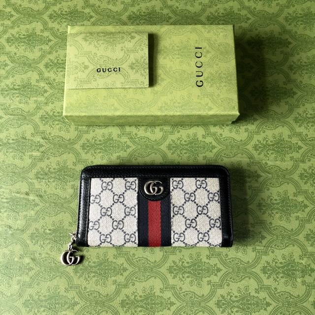 顶配版 G家新款，专柜品质，原单皮质，实物实拍。款号:523154啡pvc蓝皮。全拉链式钱包采用G高级人造帆布，配以标志性图案与条纹织带，海外顶级五金精制而成！