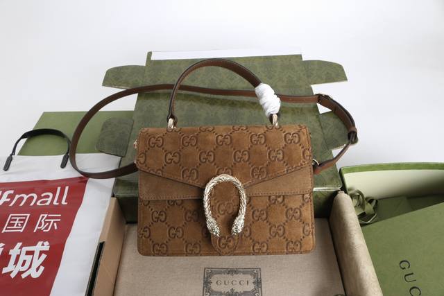 跑量价 简介 Dionysus系列迷手提包 这款手袋采用棕色Gg绒面材质匠造而成 虎头锁扣搭配翻盖设计 可拆卸皮革肩已发送挎背携 型号813400 材质采用专柜