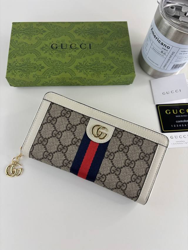 Guccl 官网同步新款！Ophidia系列～拉链长夹，采用Gg Supreme高级Pvc面料,配以标志性双G 五金唛头，经典著作红蓝色织带，精制而成！ 款号：