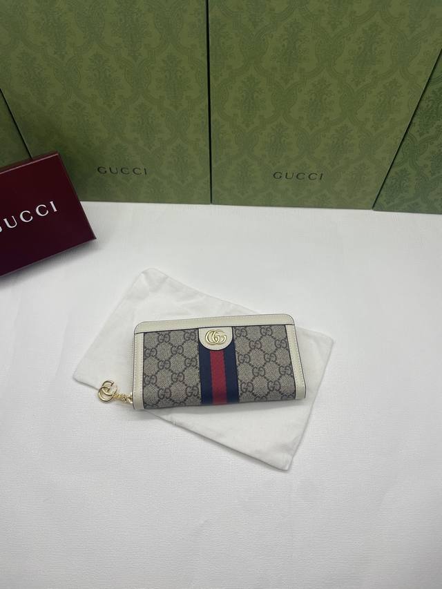 G家新款，专柜品质，原单皮质，实物实拍。款号:523154啡pvc白皮。全拉链式钱包采用G高级人造帆布，配以标志性图案与条纹织带，海外顶级五金精制而成！尺寸: